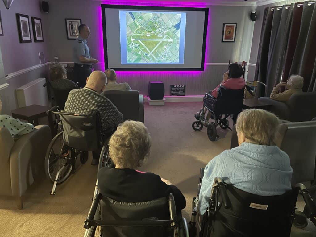 Man gives RAF talk at care home on cinema screen